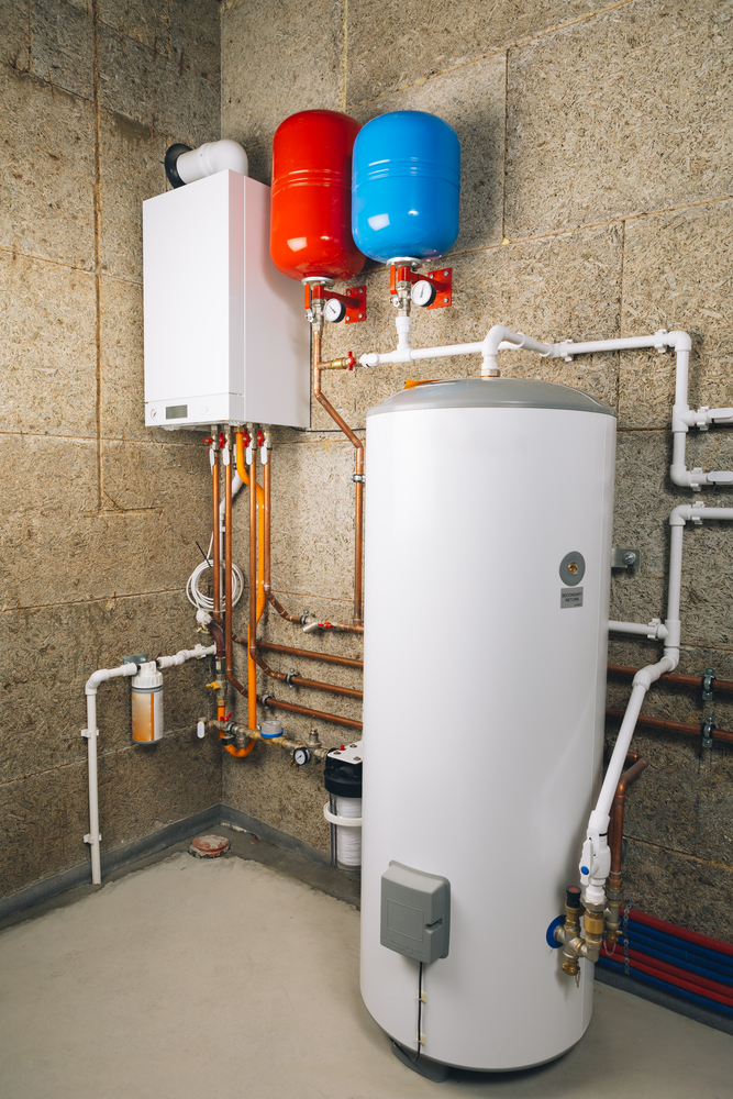 Modern boiler and tanks in utility room